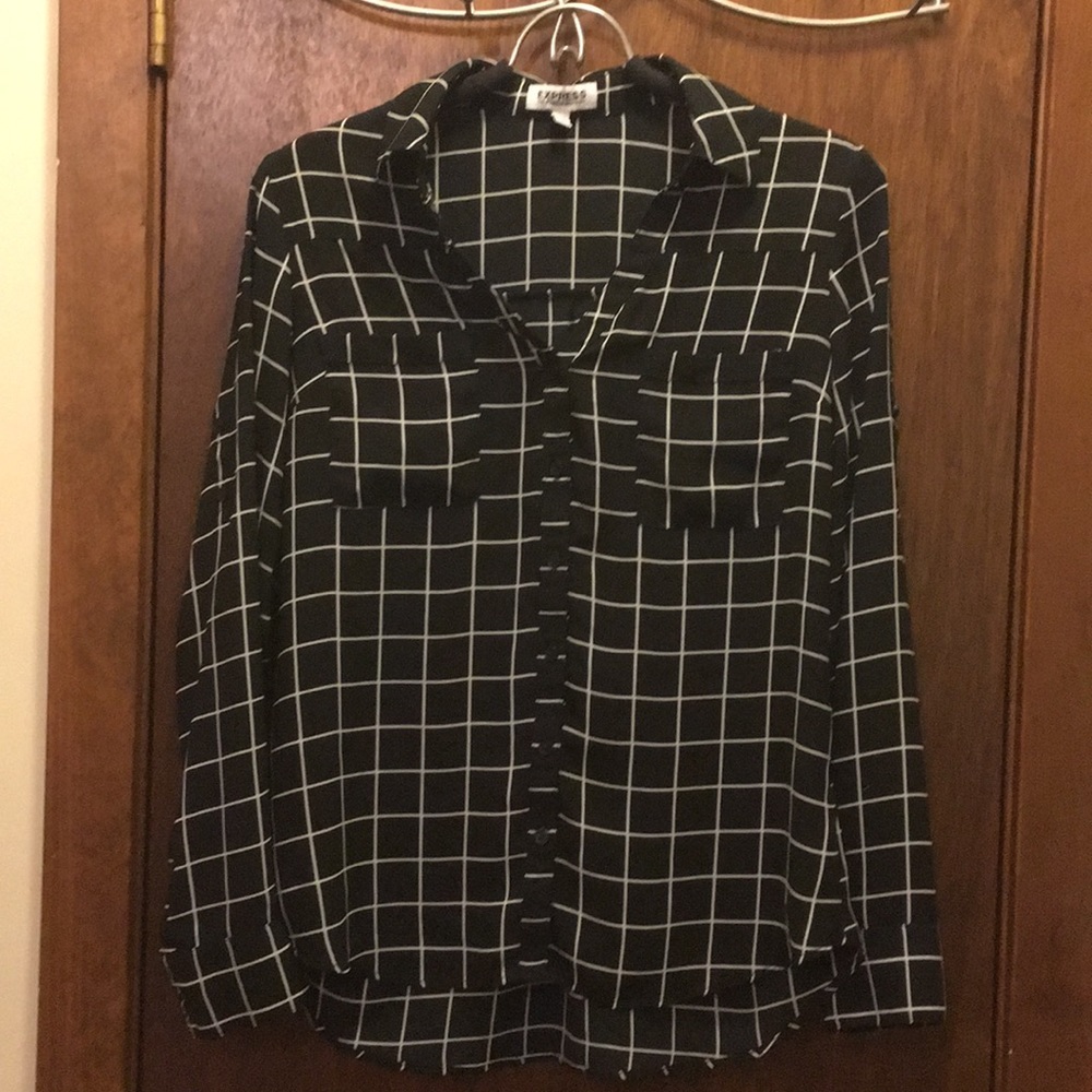 Black and white checkered blouse.